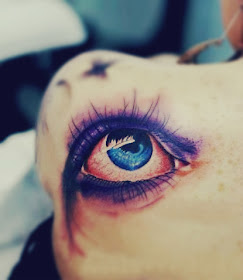 vivid eye tattoo on the back
