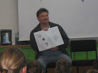 Mr Briggs is telling room8 and 9 about the design.