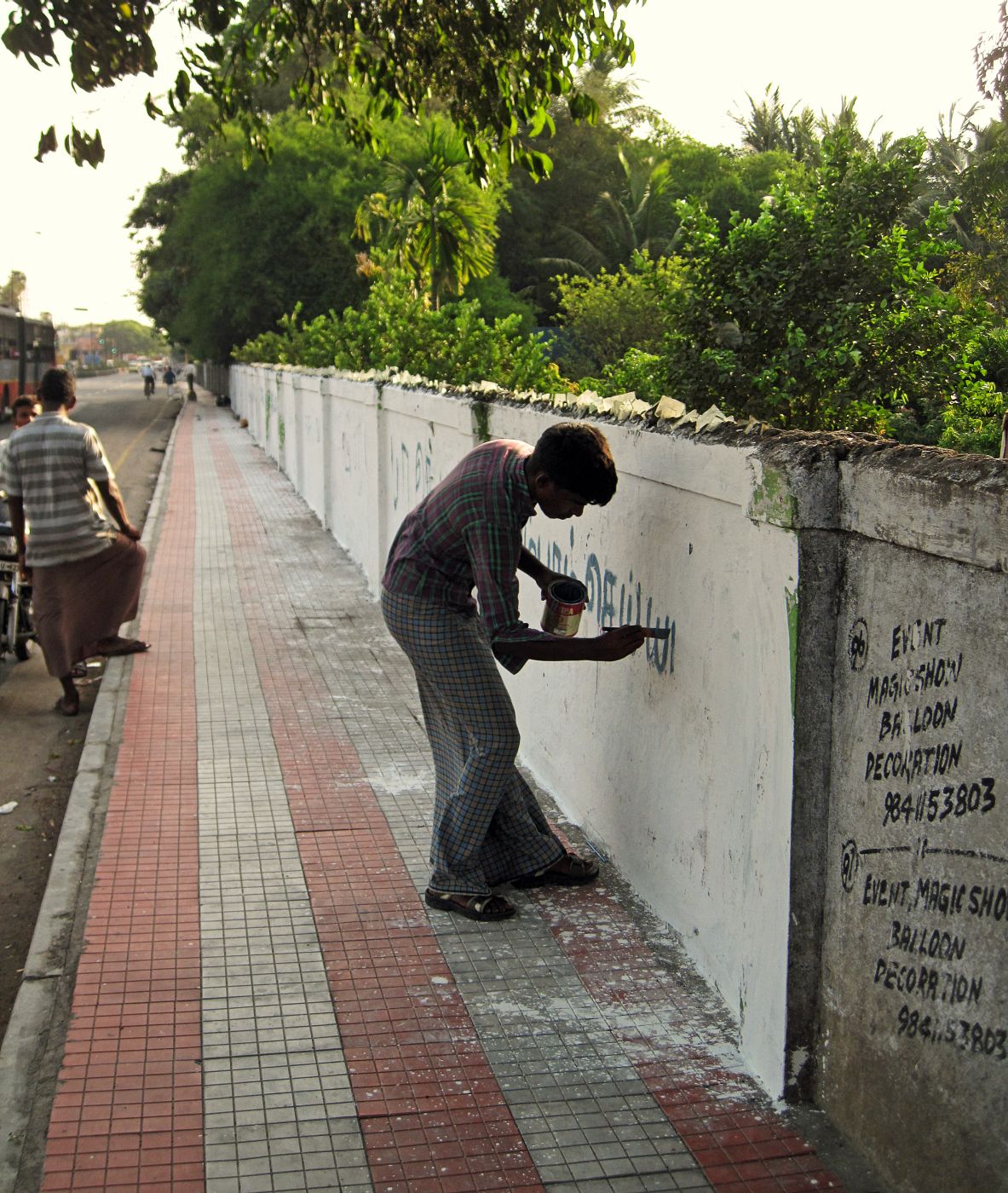 painter painting wall
