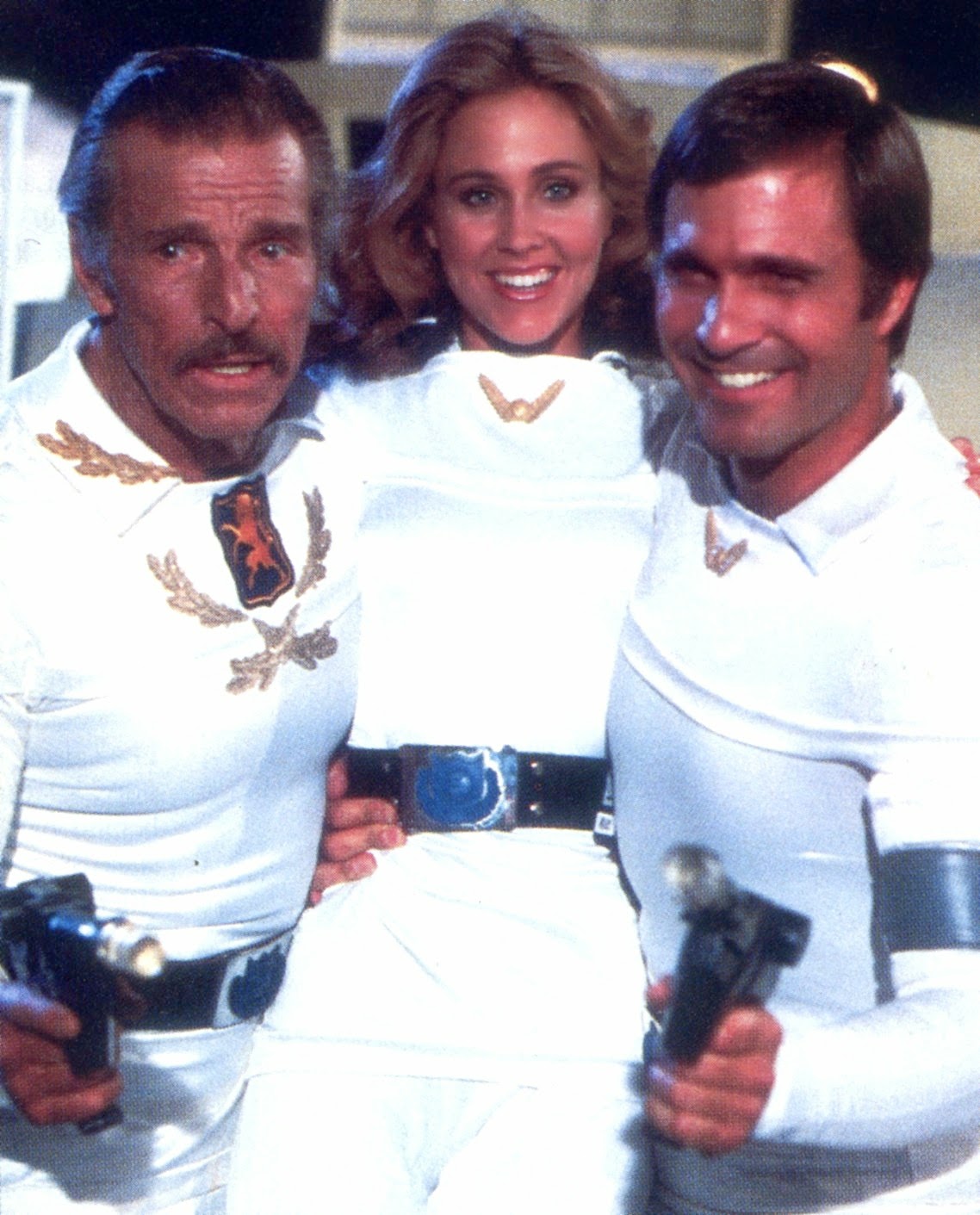 Groovy History - Buster Crabbe, Erin Gray and Gil Gerard on the set of the  TV series Buck Rogers in the 25th Century (1979) 📺