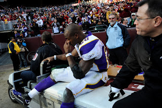 Running back Adrian Peterson #28 of the Minnesota Vikings is helped off the field after being injured in the third quarter against the Washington Redskins at FedEx Field on December 24, 2011 in Landover, Maryland. (December 23, 2011 - Source: Patrick Smith/Getty Images North America)