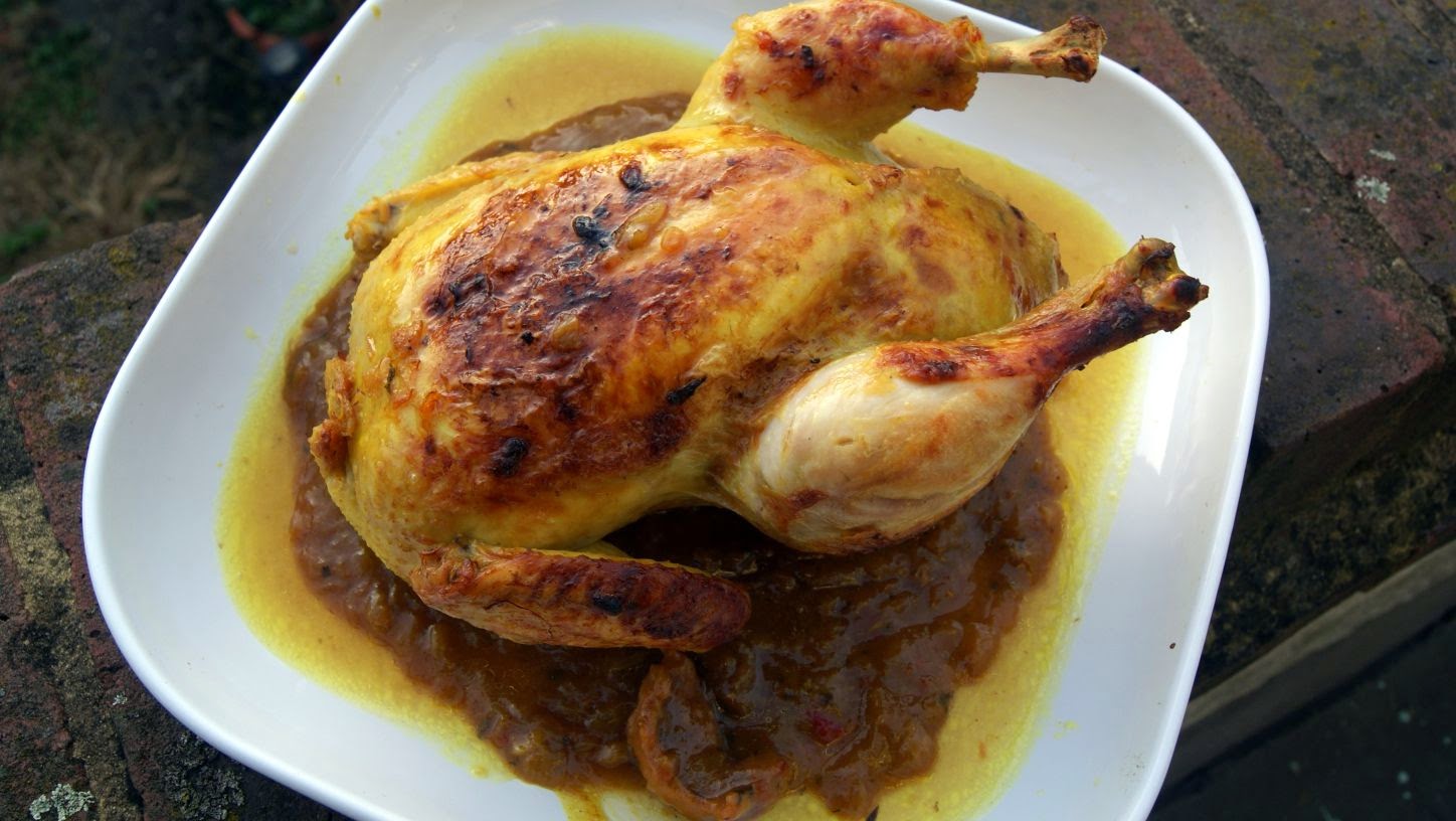 Moroccan Chicken M'qualli (mqualli) and stuffed with sweet couscous, a