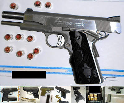 Loaded guns discovered in carry-on bags.