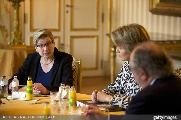 Belgian State Secretary for Poverty, Fraud and Science Elke Sleurs and Belgium's Queen Mathilde attend a presentation on poverty at the Royal Palace