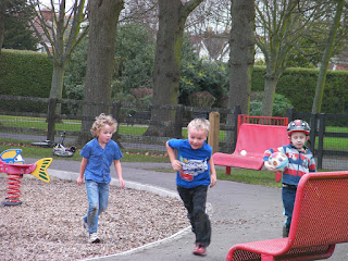 boys playing football in the park
