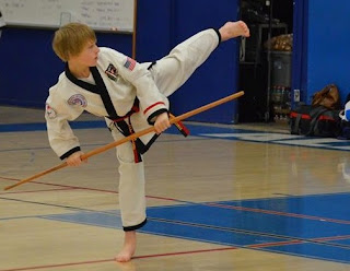 Benefits of kids doing taekwondo and karate classes Taekwondo kick doing karate kick