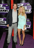 Carrie Underwood with husband on the purple carpet