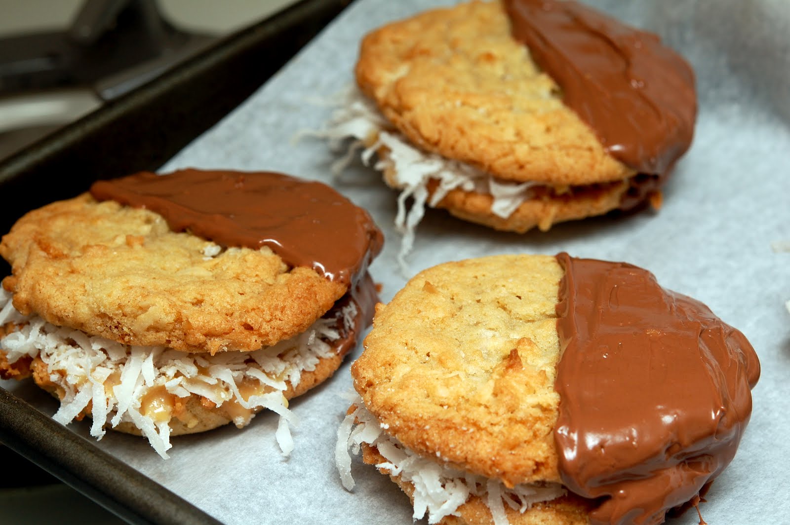 DULCE DE LECHE STUFFED COCONUT COOKIES DIPPED IN MILK CHOCOLATE Hugs