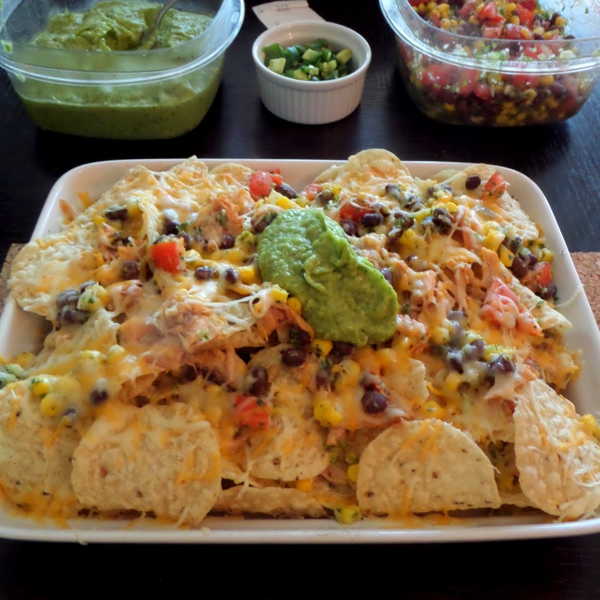 Chicken and Black Bean Salsa Nachos:  Crunchy tortilla chips layered with leftover rotisserie chicken, black bean and corn salsa, and shredded cheese.