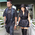 Kim Kardashian shows off her legs in silk mini dress and over the knee boots... as she dyes her hair dark for Christmas  
