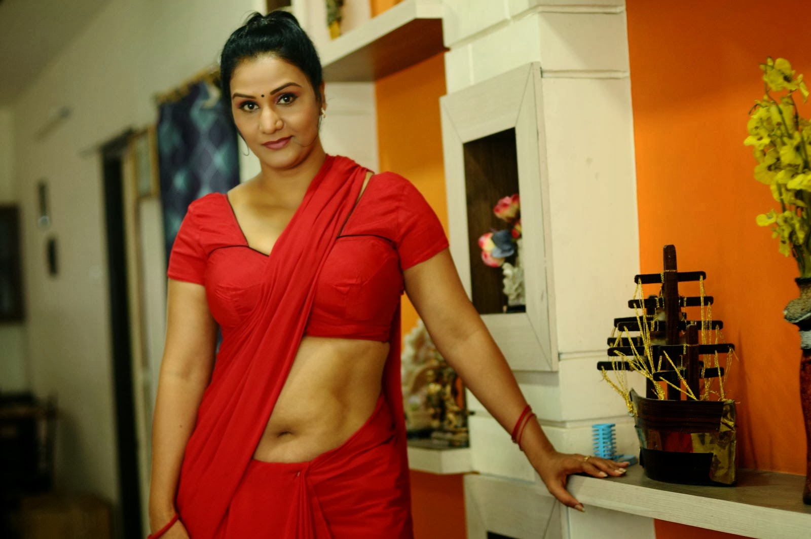 Actress Apoorva Hot Navel Show in Red Saree Photo Gallery.