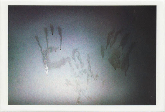 dirty photos - fumus - a photo of hand trails on humid glass