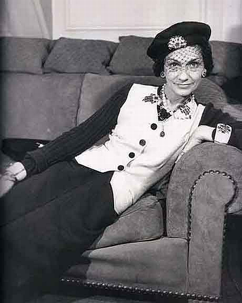 Coco Chanel portrait with pearl necklaces and her favourite cuffs