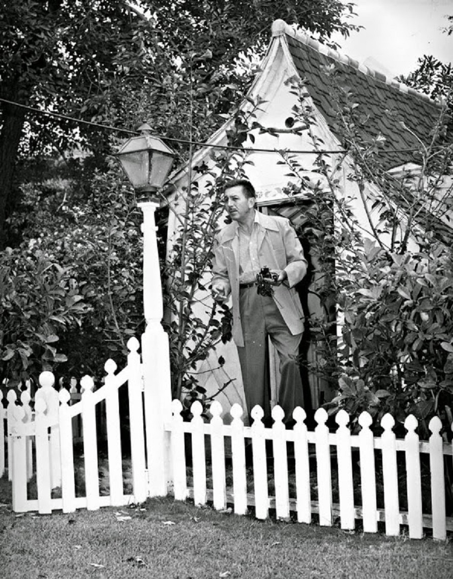 Walt Disney at the playhouse on his property.