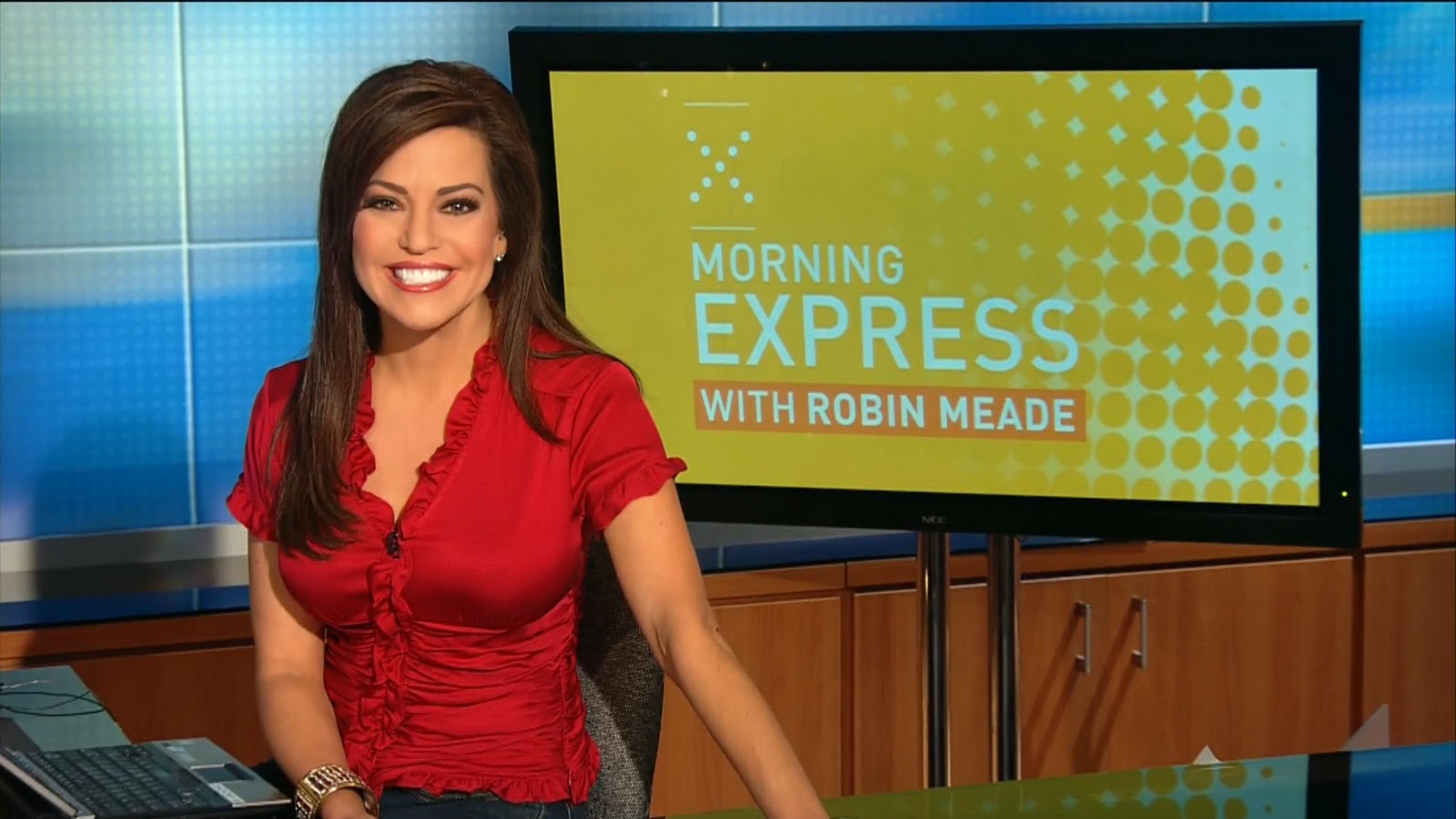Robin Meade - red silk ruffled blouse.