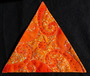 Het oranje driehoekje voor het quiltersgilde. Thema : movement