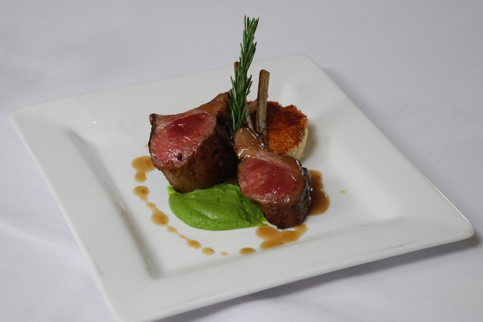 Roasted New Zealand Rack of Lamb with Lyonnaise Potato Cake, Bacon