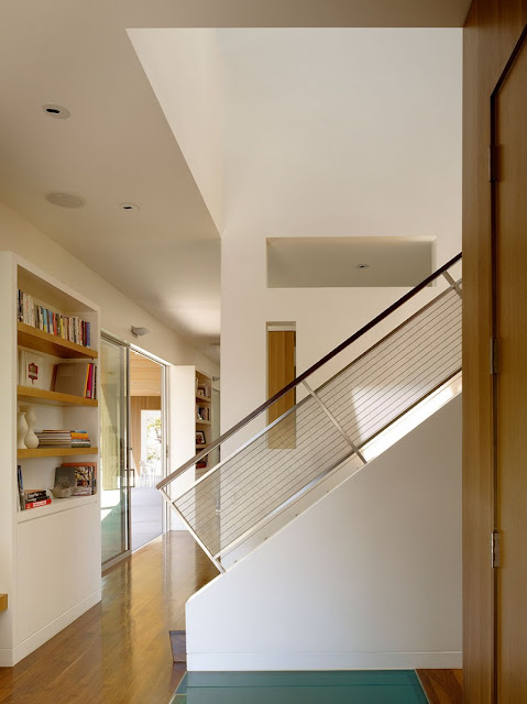 Details in Home with Wooden Sheleves and Simple Staircase under the White Ceiling