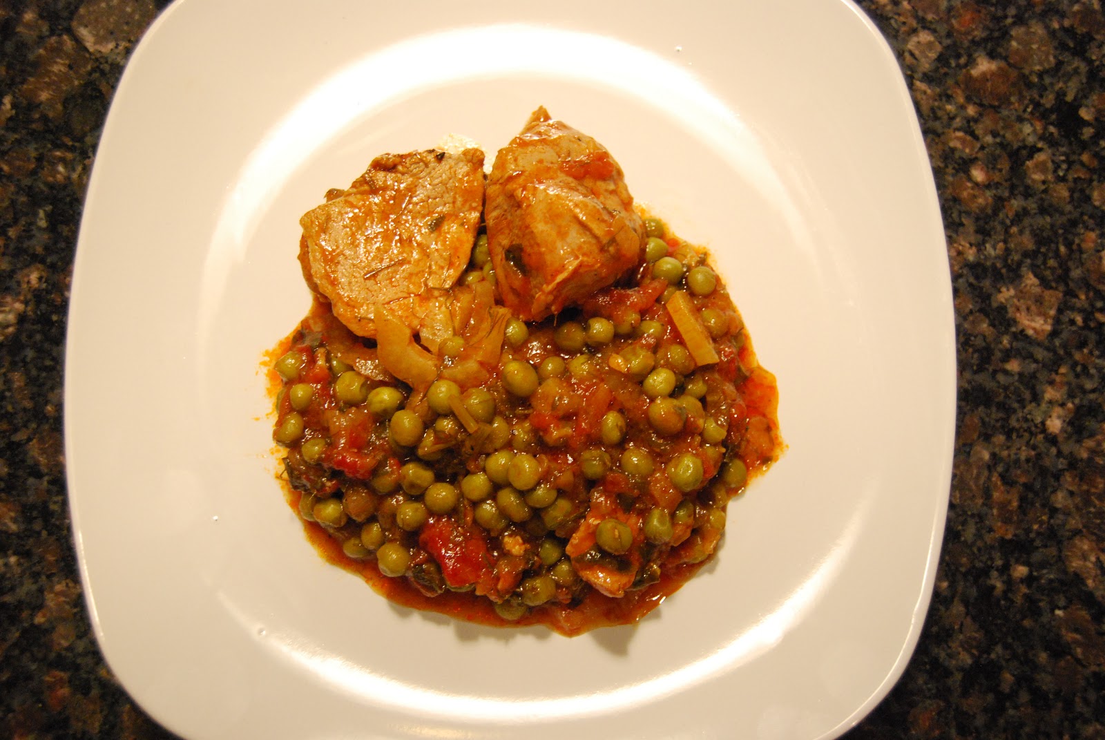 Greek Fusion Cuisine Pork Tenderloin with Fennel and Peas in tomato sauce