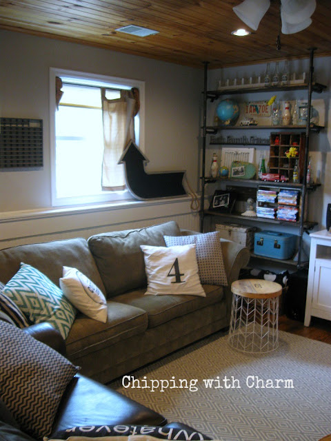 Chipping with Charm: Family Room Redo...Pipe shelves www.chippingwithcharm.blogspot.com