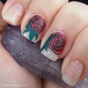 Romantic and sparkly nail art featuring roses and diamond glitter, matted.
