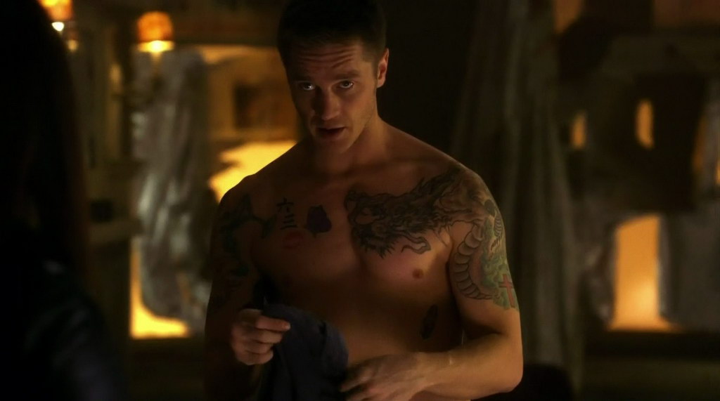 Devon Sawa is shirtless with fake (I hope) tattoos on the episode "Int...