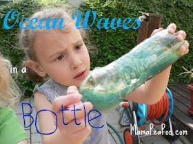 child testing how waves work with DIY ocean in a bottle