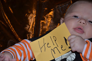 Baby with a help me sign