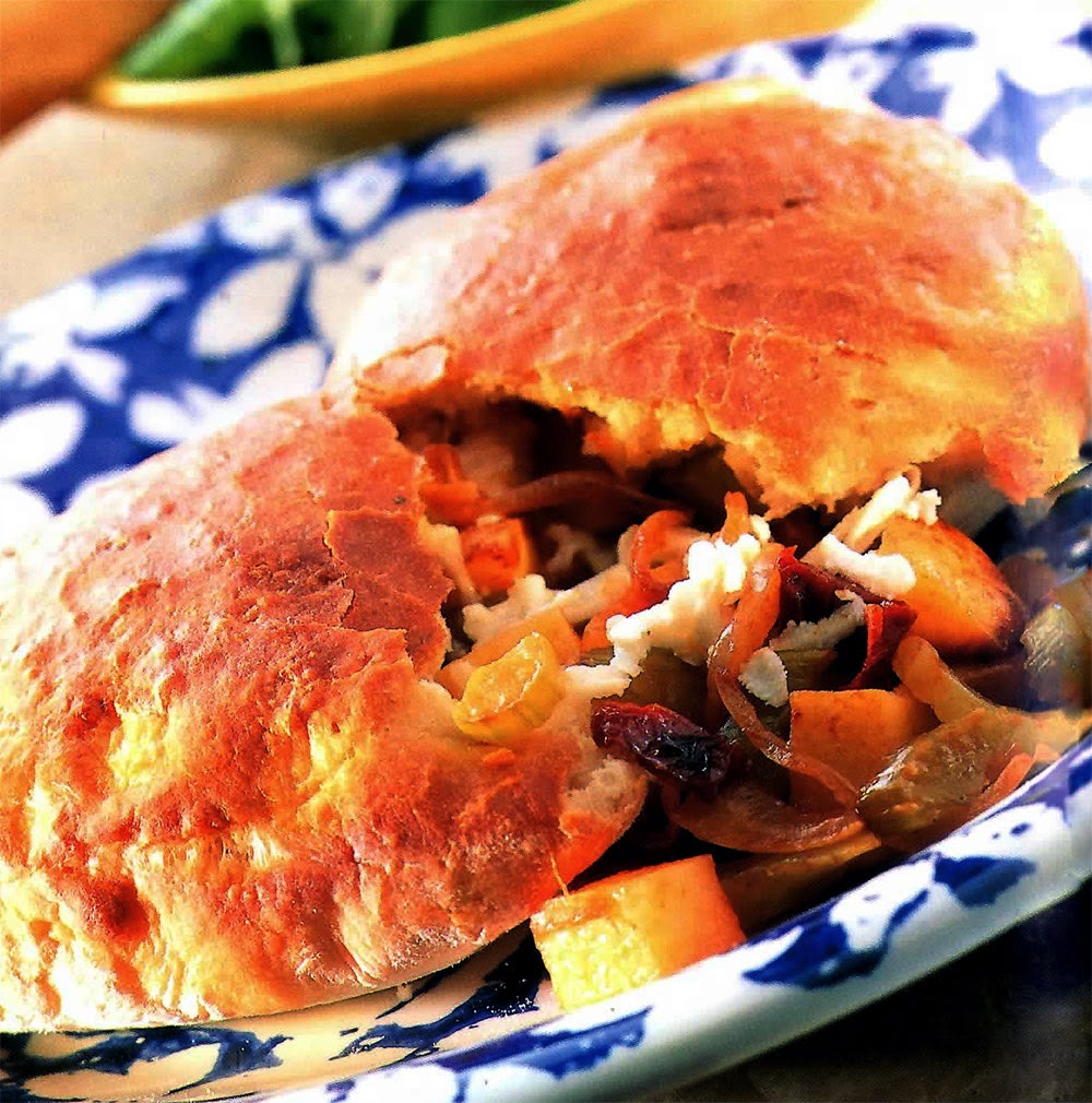 Potato and Tomato Calzone: a pasty made with pizza dough that has a vegetarian potato, tomato and cheese filling.