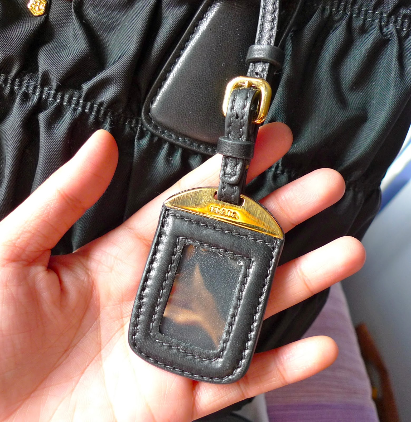 prada bag tag