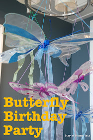 Butterfly birthday party with hanging butterfly decorations