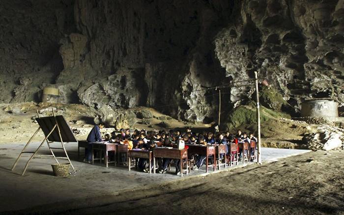 Children attend class at the Dongzhong (literally means in cave) primary school at a Miao village in Ziyun county, southwest China's Guizhou province. The school is built in a huge, aircraft hanger-sized natural cave, carved out of a mountain over thousands of years by wind, water and seismic shifts.Picture: REUTERS/China Daily