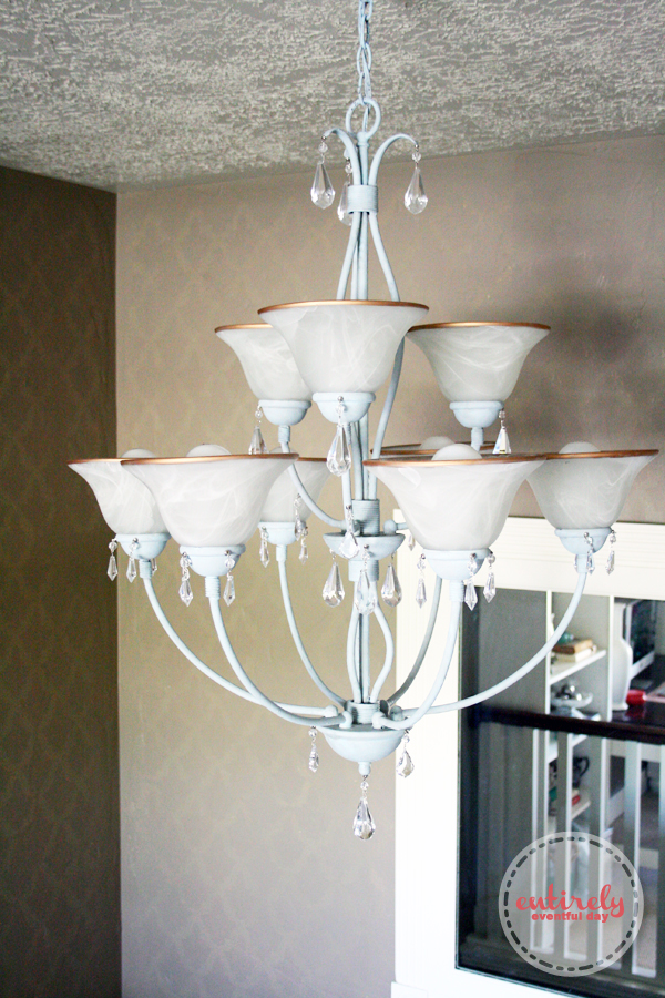 DIY French Country Chandelier. Take a builder-grade light fixture and make it awesome using chalk paint and other tricks. Click to see how. www.entirelyeventfulday.com #chandelier #lighting #diy #chalkpaint