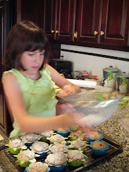 Suzie takes a turn at the confectioners sugar.