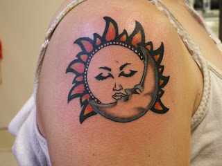 brightly coloured Sun and Moon tattoo