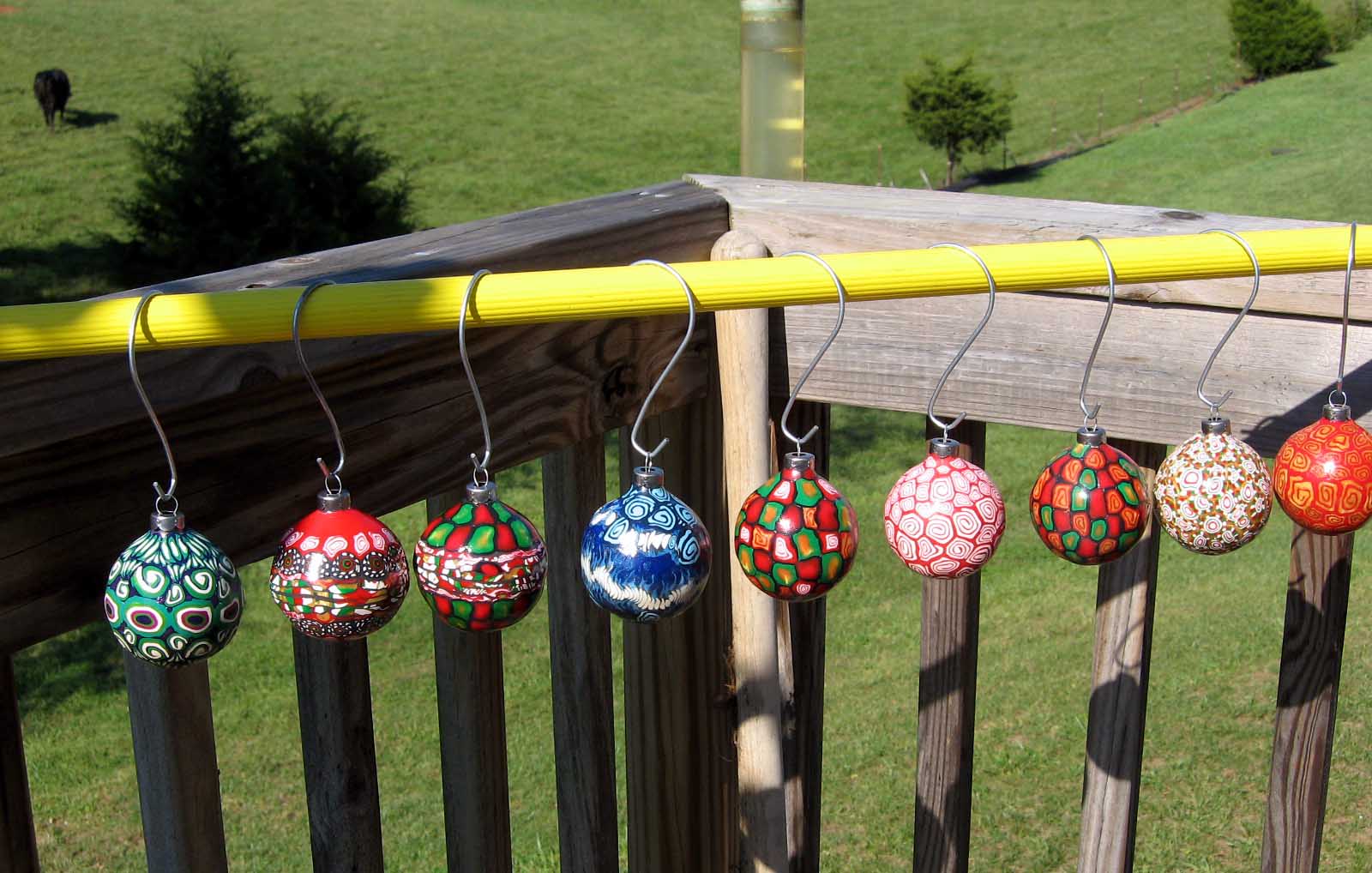 Artist At Work Sealing Ornaments with Cows