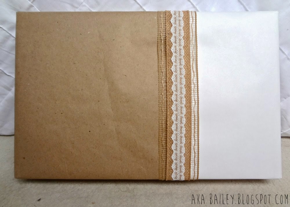 Brown and white gift wrap with burlap ribbon and lace
