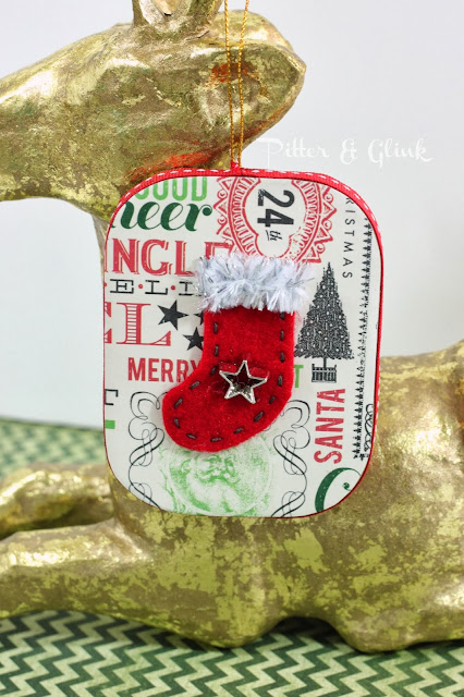 Make a vintage-inspired ornament complete with tiny felt stocking from a paper mache ornament!  Tutorial by Pitter and Glink