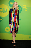Jaime King in a colorfuol dress on the black carpet
