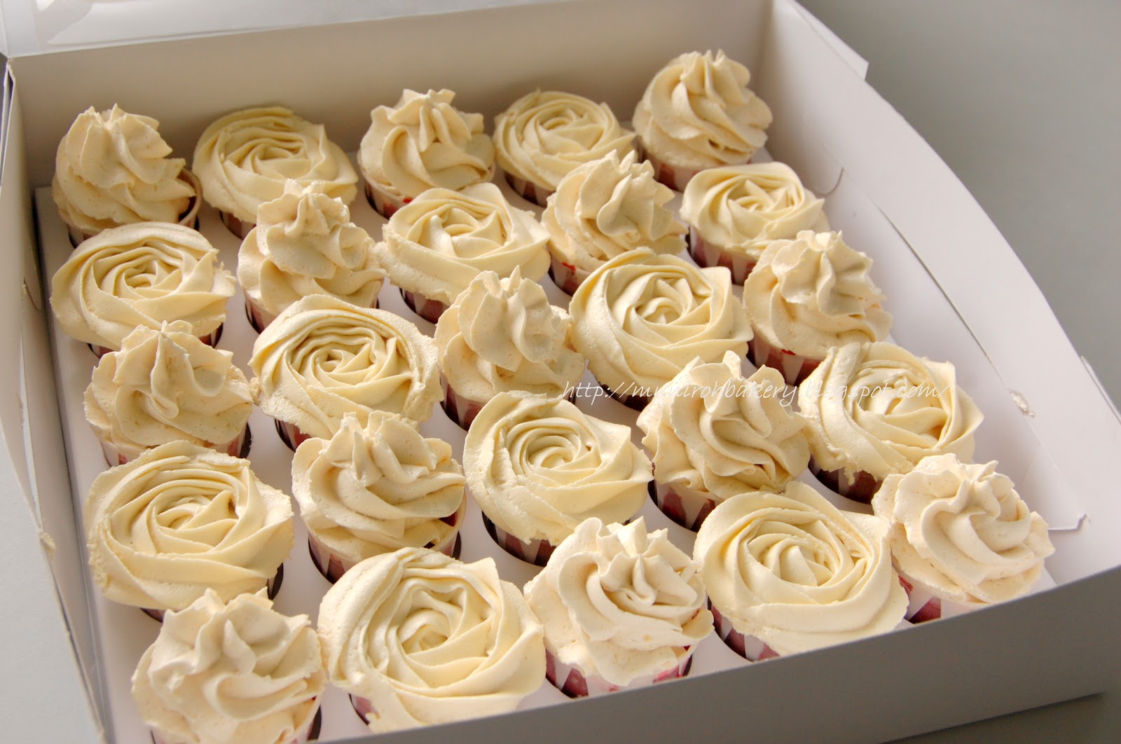 Red velvet cake with vanilla frosting and cream cheese frosting Muniroh's Bakery