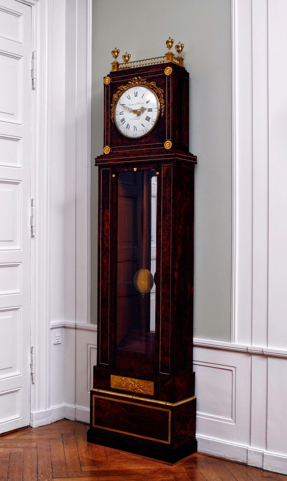 Long-case clock; mahogany veneered with thuja burr, with gilded bronze and brass David Roentgen, movement by Peter Kinzing, Germany, 1780-1790