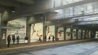 Paper Chase art in International District Transit Tunnel Station