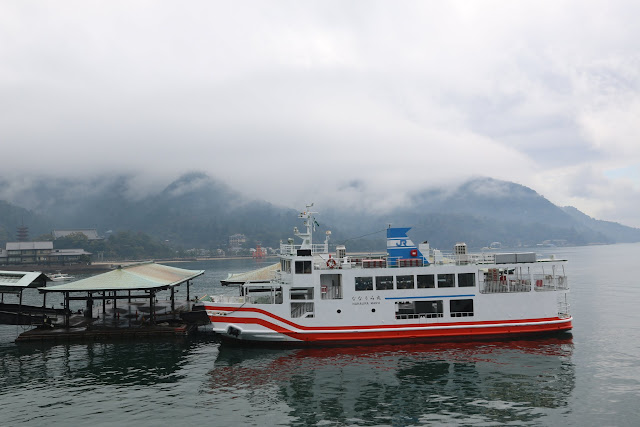 Arriving at the ferry terminal at Miyajima Island from Hiroshima ferry port, an hour drive outside of the city in Japan Arriving at the ferry terminal at Miyajima Island from Hiroshima ferry port, an hour drive outside of the city in Japan