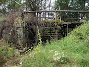 . to the mansion, running over a tiny stream that separates the house from .