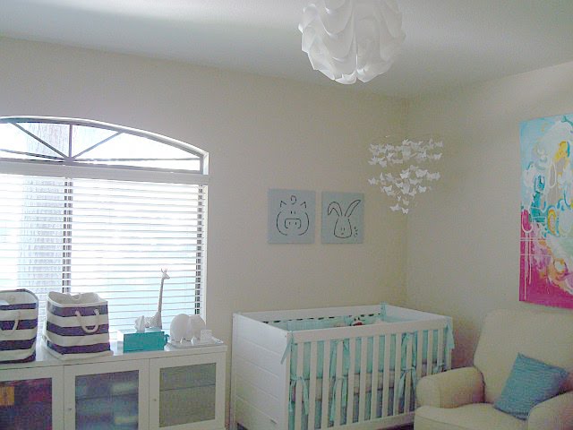 baby room with queen bed