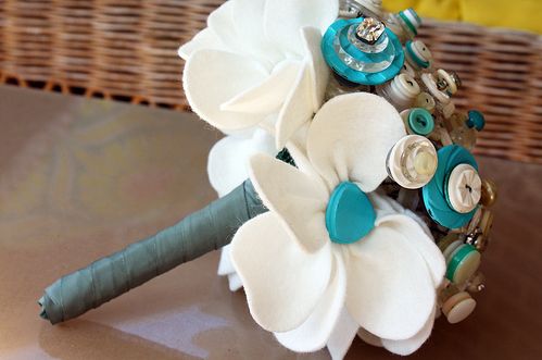 a turquoise and ivory button bouquet is absolutely stunning