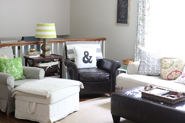 stenciled ampersand pillow with striped throw in leather chair with Behr Castle Path paint via www.goldenboysandme.com