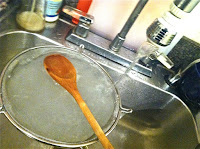 rinsing cooked tapioca pearls under a cold tap