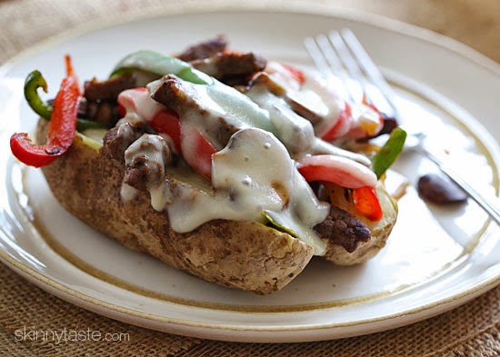 Quick skillet steak with onions, peppers and mushrooms are loaded on top of a baked potato and topped with melted cheese – this is awesome and perfect for the meat and potato lover in your life!