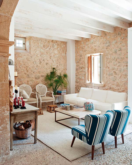 A country villa in Mallorca, Spain, with bare stone walls and pebble floors. See more at www.myparadissi.com